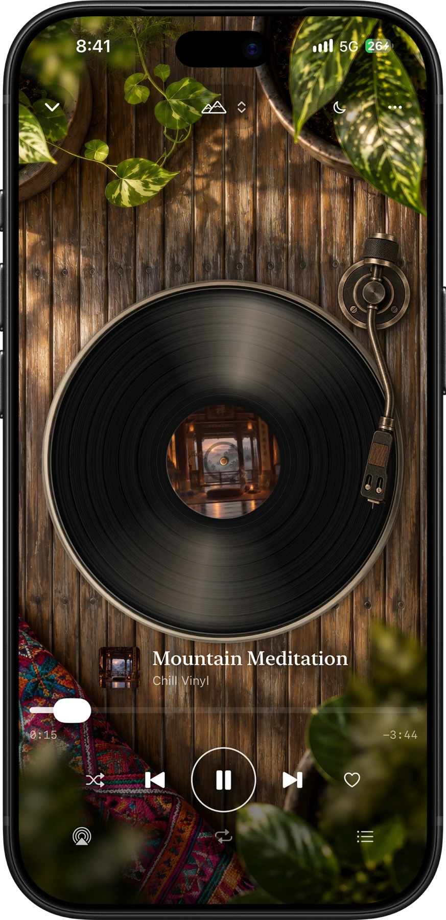 Chill Vinyl music controls on iPhone in the wood and greenery scene